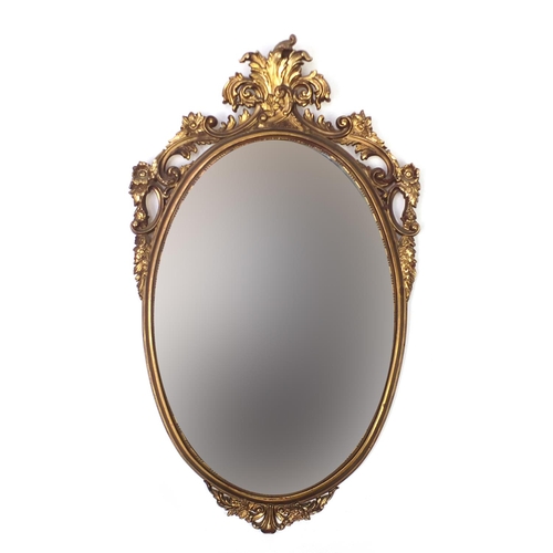 62 - Oval gilt framed wall hanging mirror, 83cm x 51cm