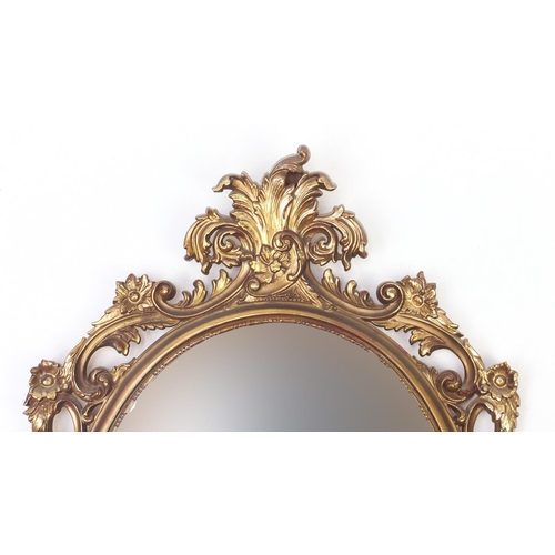 62 - Oval gilt framed wall hanging mirror, 83cm x 51cm