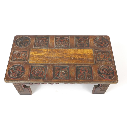 50 - African coffee table carved with figures and animals, with marble insert, 35cm H x 90cm W x 50cm D
