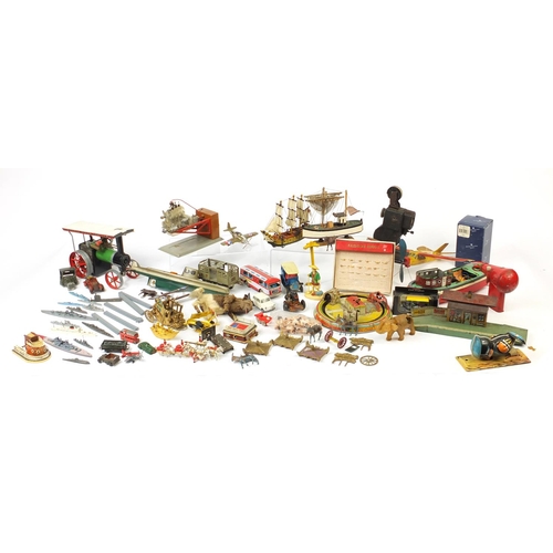 698 - Vintage toys including tin plate vehicles, a Mamod steam tractor, hand painted figures and a clockwo... 