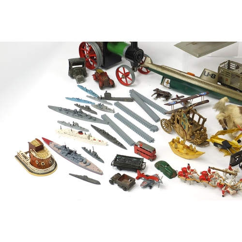 698 - Vintage toys including tin plate vehicles, a Mamod steam tractor, hand painted figures and a clockwo... 