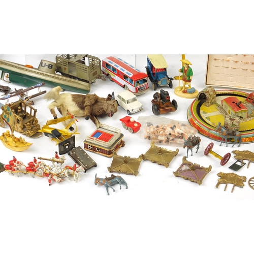 698 - Vintage toys including tin plate vehicles, a Mamod steam tractor, hand painted figures and a clockwo... 