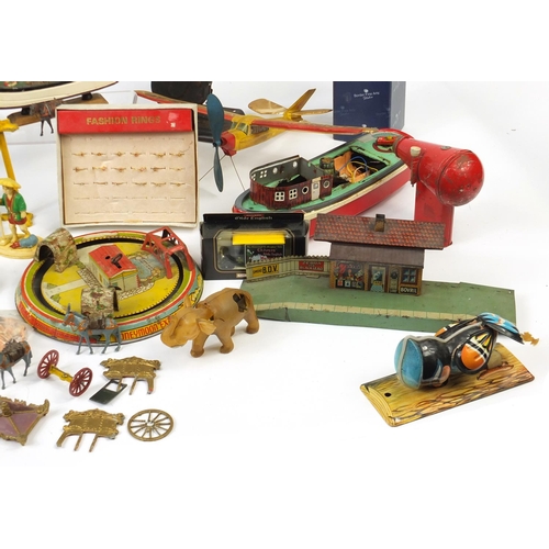 698 - Vintage toys including tin plate vehicles, a Mamod steam tractor, hand painted figures and a clockwo... 