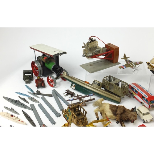 698 - Vintage toys including tin plate vehicles, a Mamod steam tractor, hand painted figures and a clockwo... 