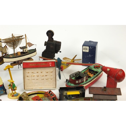 698 - Vintage toys including tin plate vehicles, a Mamod steam tractor, hand painted figures and a clockwo... 