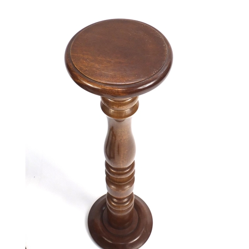 81 - Mahogany torchere and a nest of two tables, the torchere 85cm high