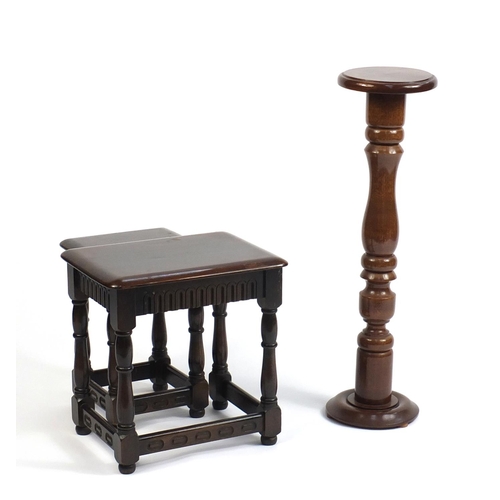 81 - Mahogany torchere and a nest of two tables, the torchere 85cm high