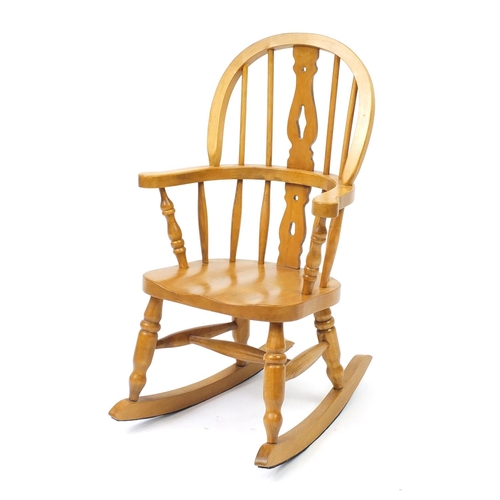 63 - Light oak child's rocking chair, 75cm high