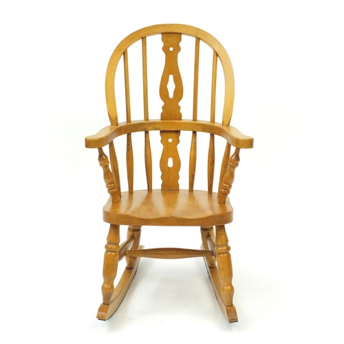 63 - Light oak child's rocking chair, 75cm high