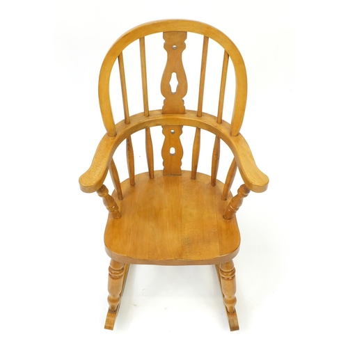 63 - Light oak child's rocking chair, 75cm high