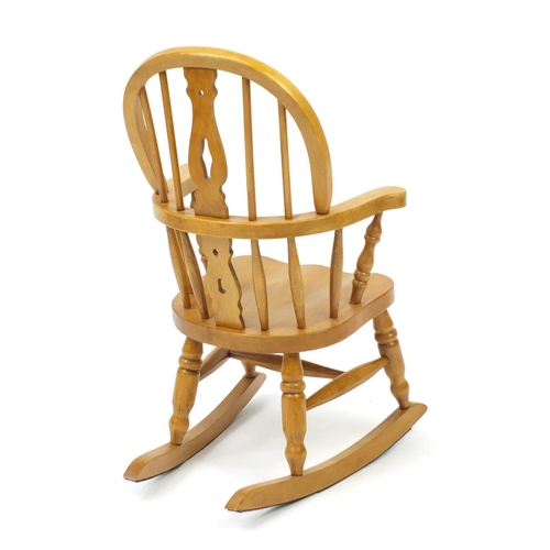 63 - Light oak child's rocking chair, 75cm high