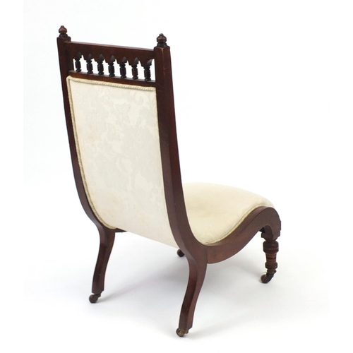 37 - Victorian mahogany framed sleigh chair with cream floral upholstery, 93cm high