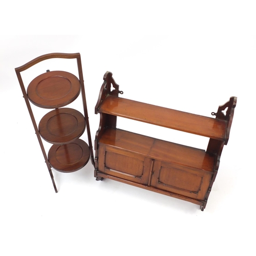 70 - Walnut wall hanging spice rack and a folding mahogany three tier cake stand