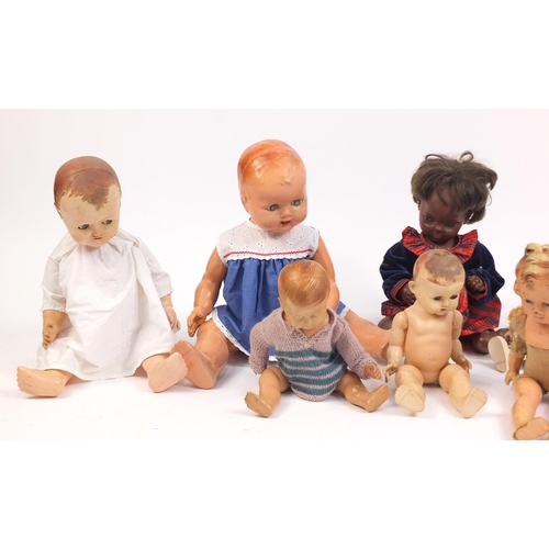 622 - Eight vintage composite dolls, some with articulated limbs and open/close eyes, the largest 62cm hig... 