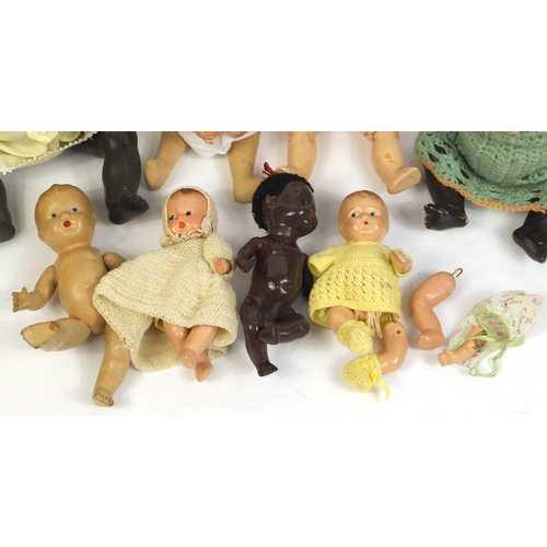 660 - Ten vintage composite dolls, some with jointed limbs and open/close eyes, the largest 42cm high