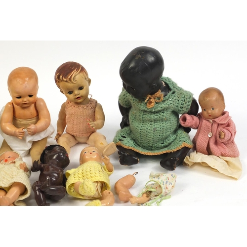 660 - Ten vintage composite dolls, some with jointed limbs and open/close eyes, the largest 42cm high