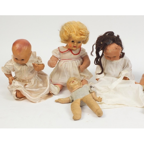 699 - Ten vintage composite dolls some with jointed limbs and open/close eyes, the largest 50cm high