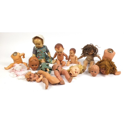 710 - Eight vintage composite dolls, some with jointed limbs and open/close eyes, the largest 60cm high