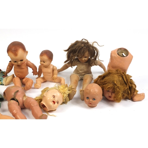 710 - Eight vintage composite dolls, some with jointed limbs and open/close eyes, the largest 60cm high