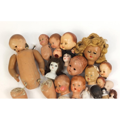 609 - Vintage dolls heads and limbs including some bisque