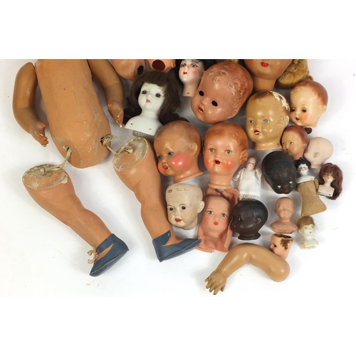 609 - Vintage dolls heads and limbs including some bisque