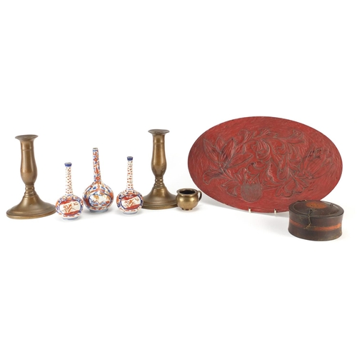 651 - Miscellaneous items including a pair of coppered candlesticks, three Imari vases and a lacquered tra... 