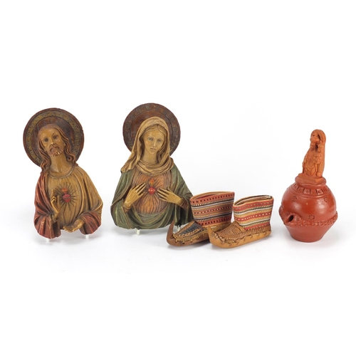 654 - Objects including a pair of hand painted religious icons and a pair of miniature leather and embroid... 