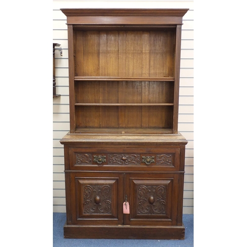 97 - Oak bookcase with three shelves above a secretaire  drawer and a pair of cupboard doors, 224cm H x 1... 