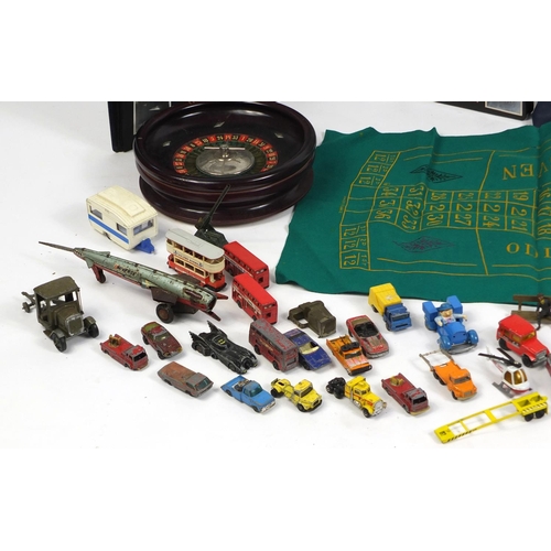 680 - Vintage and later toys, stamps and postcards including die cast vehicles, 1960's dolls and a roulett... 