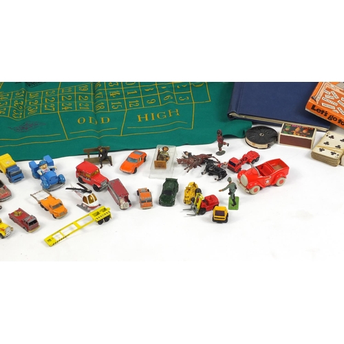 680 - Vintage and later toys, stamps and postcards including die cast vehicles, 1960's dolls and a roulett... 