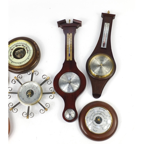 694 - Seven wall hanging barometers, the largest 50cm in length