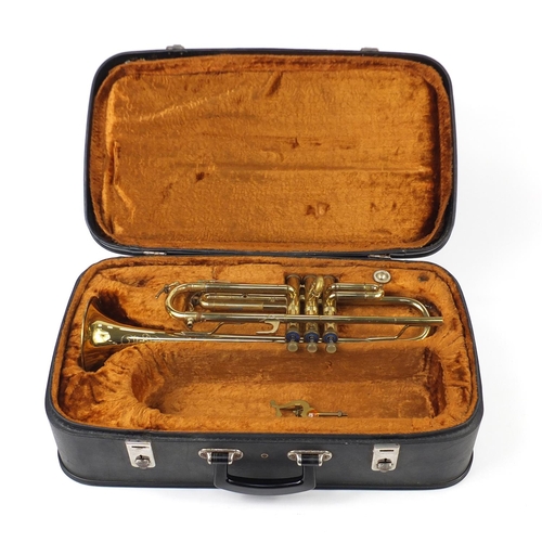 599 - Brass Corton coronet, with fitted case, 50cm in length