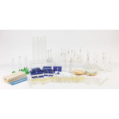 648 - Large selection of chemist measures and  syringes, test tubes and beakers