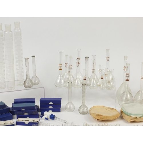 648 - Large selection of chemist measures and  syringes, test tubes and beakers