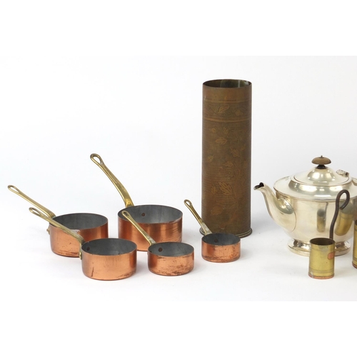 623 - Metalwares including a large copper flagon, graduated set of pans and a trench art shell case