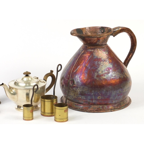 623 - Metalwares including a large copper flagon, graduated set of pans and a trench art shell case