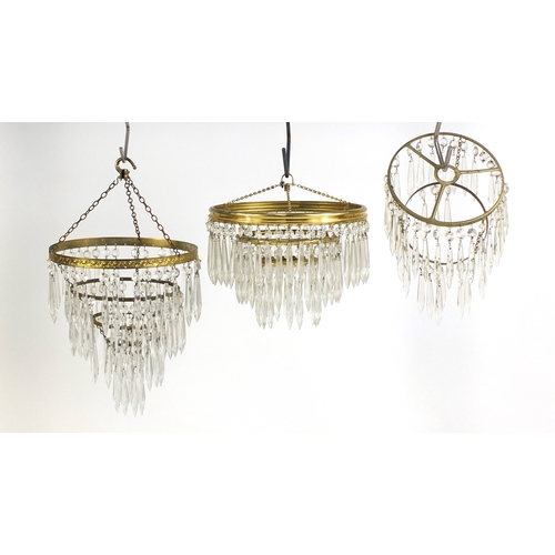 701 - Three circular brass chandeliers with cut glass drops, the largest 40cm high x 25cm in diameter