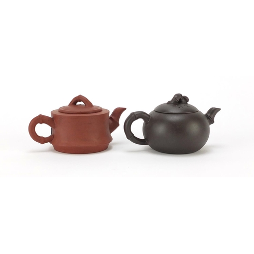 2301 - Two Chinese yixing terracotta teapots, character marks to the bases, the largest 7.5cm high