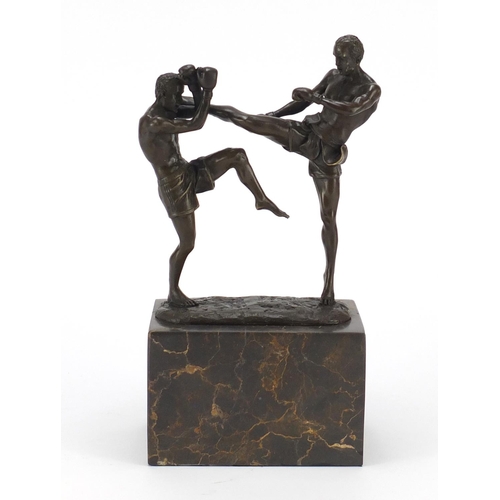 2072 - Patinated bronze study of two mixed martial artists raised on rectangular marble base, 26cm high