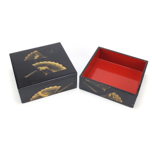 2267 - Japanese black lacquer sectional box gilded with fan motifs, 16cm H x 22.5cm W x 21cm D