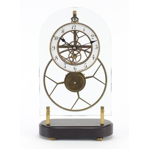 2248 - Glass fronted brass Skelton clock, the enamelled chapter ring with Arabic numerals, 37cm high