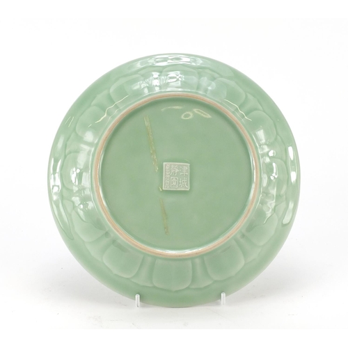 2227 - Chinese celadon glazed plate decorated with a waterfall outside a building, character marks to the r... 
