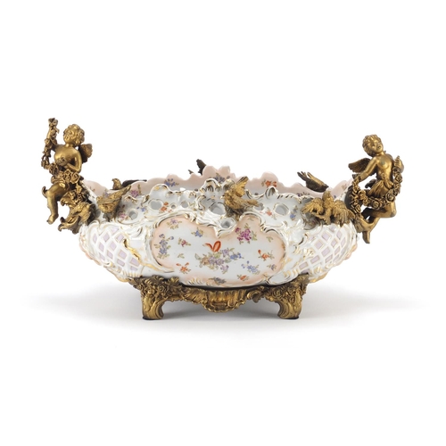 2319 - Continental porcelain centre piece with gilt metal mounts decorated with flowers, 40cm wide