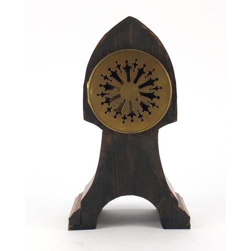 2288 - Mantel clock with brass mounts and enamelled dial having Arabic numerals, 31cm high