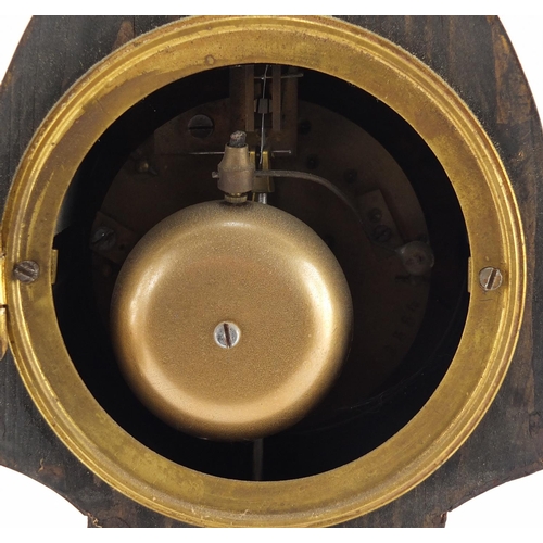 2288 - Mantel clock with brass mounts and enamelled dial having Arabic numerals, 31cm high