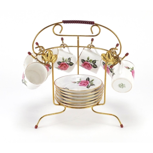 2229 - Set of six Tuscan coffee cans and saucers on a brass display stand