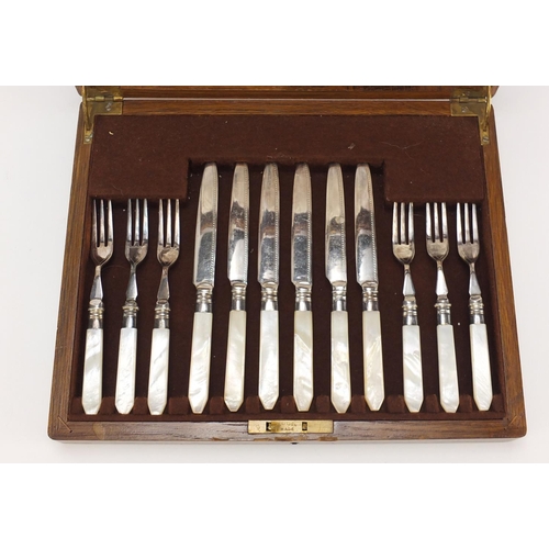 2174 - Set of six Mappin & Webb fish knives and forks with mother of pearl handles, housed in an oak cantee... 