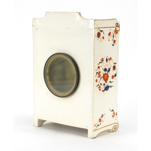 2105 - Continental porcelain clock case housing a Japy Freres movement, retailed by J W Benson, 30.5cm high