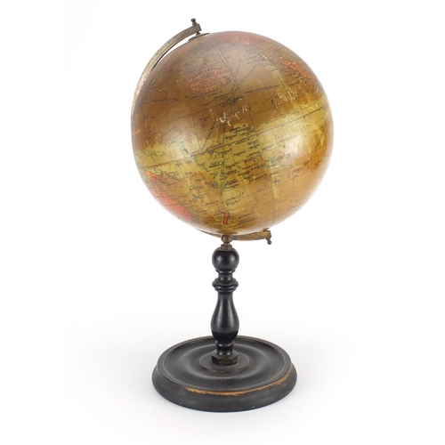 2101 - Geographia 10 inch terrestrial globe raised on an ebonised stand, 48cm high
