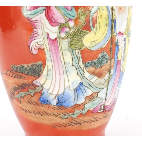 2156 - Chinese porcelain iron red ground vase, hand painted in the famille rose palette with Shou Lau holdi... 